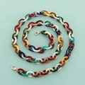 Macro view of 120cm colorful acrylic chain with gold alloy clasps for bags and phones - Flat Mixed Colors
