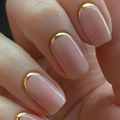 Close-up of nude pink square press-on nails with luxury gold metallic French tips - Nude Pink Gold Reverse French (CW248)