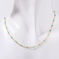 Bohemian gold chain necklace with green enamel beads displayed on a white bust - Green