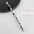Detailed view of acetic acid hair pin featuring black and white marble pattern design - Twisted Shape / Black Grey Marble