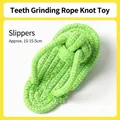 Green and white cotton rope dog chew toy in slipper shape for pet dental health - Slipper