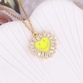 Detail of sunflower pendant with yellow enamel heart smiley and sparkling cubic zirconia - Yellow