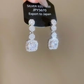 Macro shot of S925 silver earrings with sparkling zircon geometric drop and square stones - Square Pendant Style (925 Sterling Silver Earring Post) / Silver