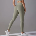 Detail of olive green high-waisted seamless yoga leggings with push-up shaping effect - S / Carbon Dust