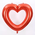 Detail of red hollow heart-shaped foil balloon with metallic luster for party decor - 40 Inch / Red
