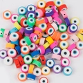 Flat round evil eye polymer clay spacer beads in various vibrant colors for DIY jewelry - Evil Eye