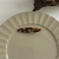 Detail of tortoise shell hair claw with France Handmade inscription on ceramic plate - Gold Label Pointed Oval Duckbill Clip