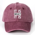 Detail of burgundy washed cotton baseball cap with white IT IS WHAT IT IS printed text - One Size(Adjustable) / Washed Wine Red