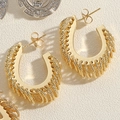 Detail of gold spiral textured C-shape hoop earrings with vintage metal finish - Gold U-Shape Texture Wrap Hoop Earrings