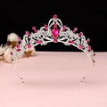 Detailed close-up of a silver baroque tiara featuring magenta crystals and rhinestones - No.1 Silver (Rose Red Stone)