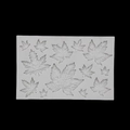 White silicone maple leaf mold with multiple leaf patterns on a black background - 50-1068 Maple Leaf / White