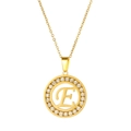 Macro detail of gold stainless steel necklace with sparkling E letter pendant - Letter E