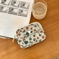 Green quilted fabric coin purse with floral pattern and secure button closure - Bellflower
