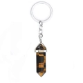 Macro detail of a hexagonal Tiger Eye crystal pillar keychain with a silver metal link chain - Tiger Eye Stone Bracelet