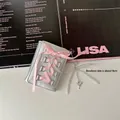 Close-up of silver balletcore wallet with pink ribbons and beaded heart charm - Balletcore Wallet + Transparent White Bead Charm
