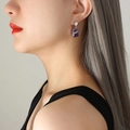 Chic purple square zircon earrings with silver metal wrap shown on a model - Steel Color Earrings (F168)