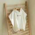 Creamy white hooded baby poncho towel with cute bear embroidery and brown trim edges - Three Bears
