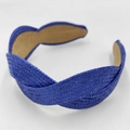 Detailed view of blue raffia braided headband with twisted cross design and non-slip lining - Sapphire Blue