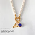 Elegant pearl necklace featuring 14K gold plated V-letter and blue crystal gemstone pendant - Letter V