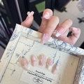 Detail of pink and white gradient French fake nails with pearls and 3D butterfly charms - By1572 Thin-winged Cicada Song / Glue Type