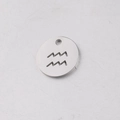 Macro shot of a 12mm stainless steel Aquarius zodiac pendant with hollowed circular design - Aquarius