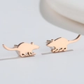 Close-up of rose gold mouse silhouette stud earrings with polished metallic finish - Little Mouse / Rose Gold