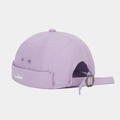 Detail view of light purple canvas docker hat featuring small white whale embroidery - Light Purple