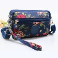Floral crossbody bag in navy blue nylon with red roses and multiple zip pockets - Blue with Peony Floral