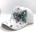 White baseball cap with colorful rhinestone butterfly and pink flower decoration - Adult / White