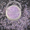 Macro shot of iridescent purple nail art glitter flakes in a clear plastic jar container - 1.5-3MM Canned / Iridescent Purple Stone