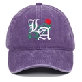 Detailed view of LA gothic letters and red rose embroidery on a purple washed cotton cap - Purple