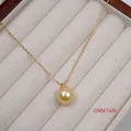 Detailed view of a 12mm golden pearl pendant necklace with 18K gold-plated chain - Necklace / 12mm / Gold