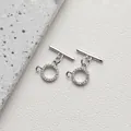 Macro shot of silver plated OT toggles with micro-pave cubic zirconia for DIY jewelry - Style H Round Beaded Zirconia / White Gold