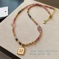 Tiger eye beaded necklace with pink butterfly pendant and golden metal accents - Rhodochrosite Crystal Necklace XL0749