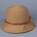 Detailed close-up of a khaki knitted bucket hat with a decorative brown woven cord tie - M (56-58cm) / Camel