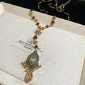 Detail of vintage beaded necklace with oval crystal pendant and amber drop on fabric - Chinese Knot Water Drop Pendant (HN10329) / Silver-Coffee