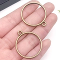 Two antique bronze circular alloy hollow frame pendants for DIY jewelry crafts - Round Bezel (22240) / 32x28mm / Bronze