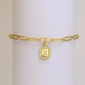 18k gold paperclip chain bracelet featuring a zircon-studded octagonal letter K pendant - Letter K