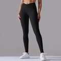 Detail view of high waisted black yoga leggings with V-shaped crossover waist design - S / Black