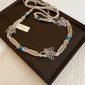 Detail view of woven bohemian belt with turquoise beads and butterfly charms - Butterfly Metal Buckle Woven Style (HN8747)