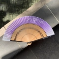Purple gradient folding fan with white floral patterns and natural bamboo ribs - Natural Wood Purple Blue