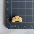 Miniature resin croissant charm shown on a centimeter ruler for size reference - 09*Flower Croissant