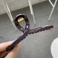 Close-up of a 11cm large dark brown hair claw clip with a glossy finish and metal spring - 11cm / Chocolate
