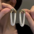 Detail of gold U-shaped buckles with silver mesh chain tassels for women's earrings - U-Shape Mesh Chain / Gold