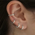 Silver geometric C-shaped earrings and ear cuffs set shown on ear for a minimalist look - Silver Metal Ear Cuff Set (5804002)