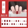 Detail of A618 Christmas press-on nails featuring reindeer designs and red glitter finish - A618 Glitter Red Stripe Deer