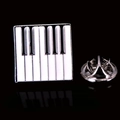 Macro shot of piano keyboard enamel brooch with silver butterfly clutch backing - Silver Piano Keyboard