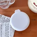 Mini spazzola per capelli bianca con specchio dal design rotondo e compatto - Bianco Crema
