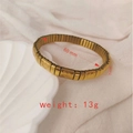 Golden stretch bracelet with heart relief design, 60mm inner diameter and 7mm width - J002-3 Gold Heart Relief