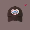 Distressed dark brown baseball cap featuring Softball MOM heart embroidery and vintage wear - Brown